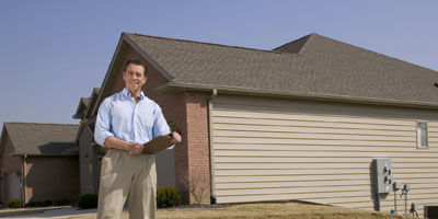 Inspector Outside of a Home